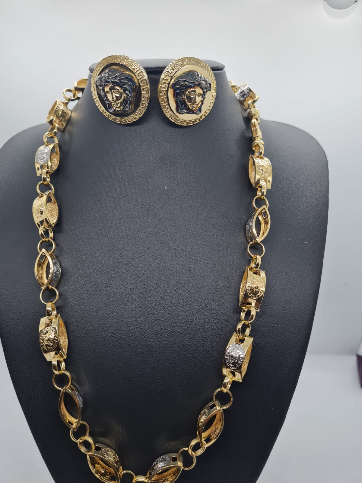 golden necklace with versace inprints